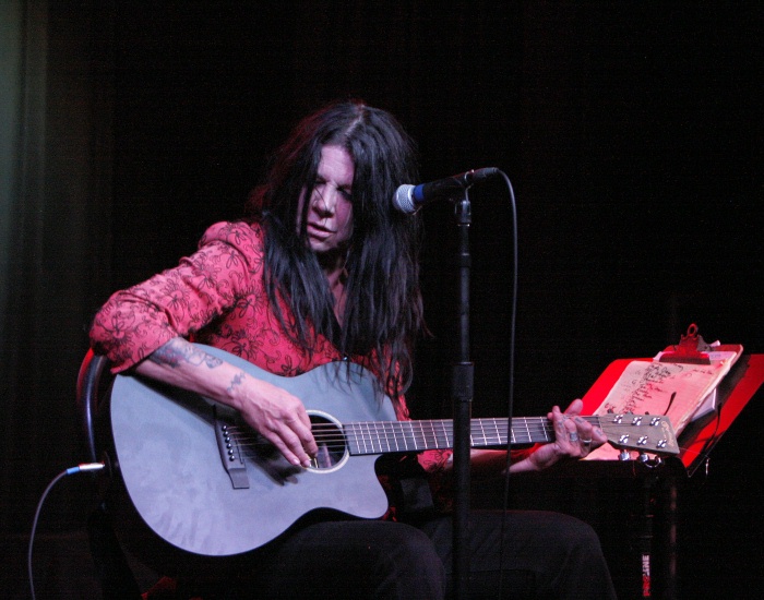 Johnette with guitar